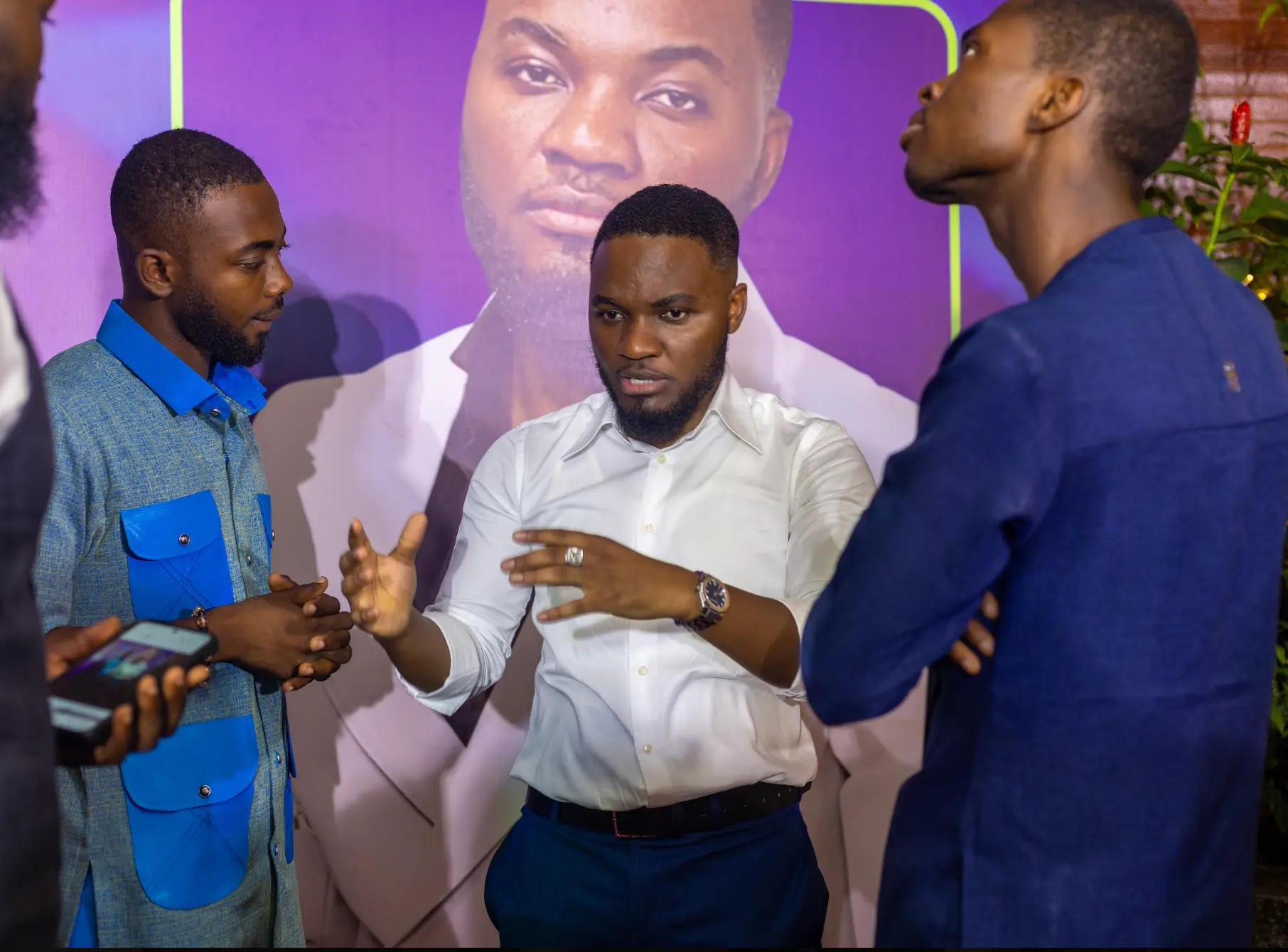 Derrick Abaitey advising business owners in conversation